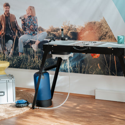 Showroom photo: Assembled camping kitchen with water pump.