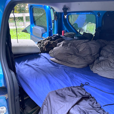 Photo of the converted bed in the car.