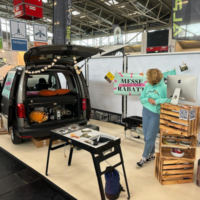 Travel Tiger exhibition stand with VW Caddy and camping modules.